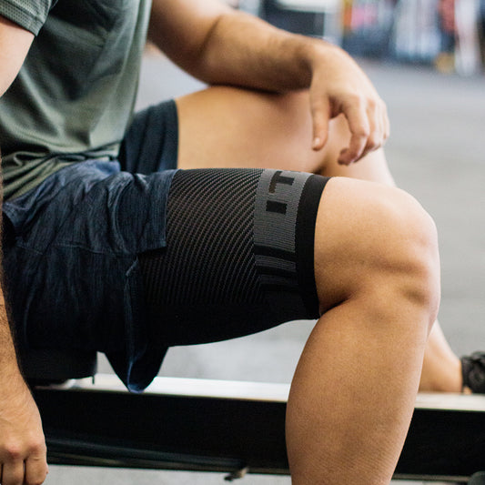 Lifestyle image for QS4 Thigh Brace Compression Sleeve - Black