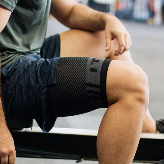Lifestyle image for QS4 Thigh Brace Compression Sleeve - Black